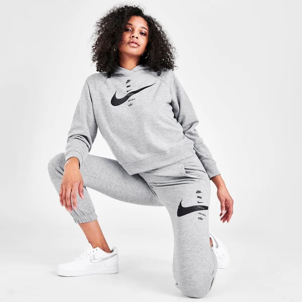 Nike Women's Sportswear Swoosh Fleece Jogger Pants in Grey/Dark Grey Heather Size Medium, Cotton/Fleece